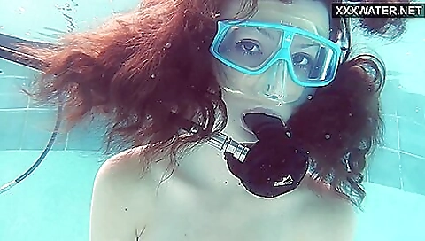 Brunette gets wet in the pool and masturbates in the shower