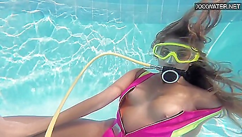 Beautiful hottie with big tits is relaxing on the beach