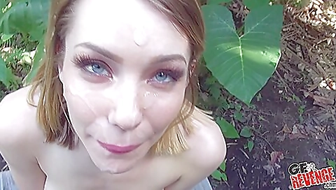 Brunette in a sexy dress has facial with guy in the park