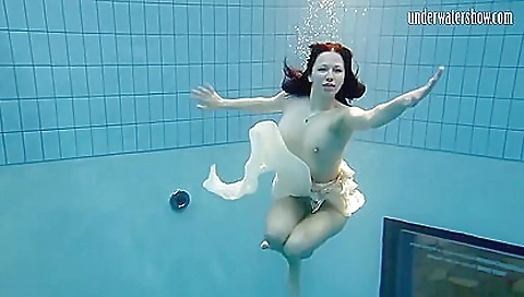 Brunette teen in shower naked and moans at being submerged