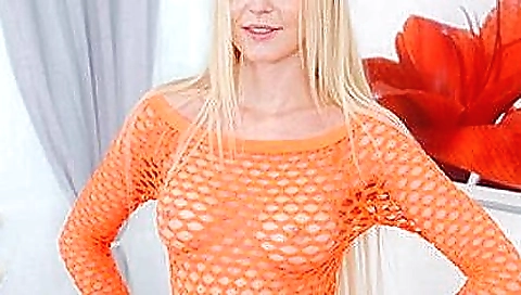 Sexy blonde solo female in fishnets shows her body