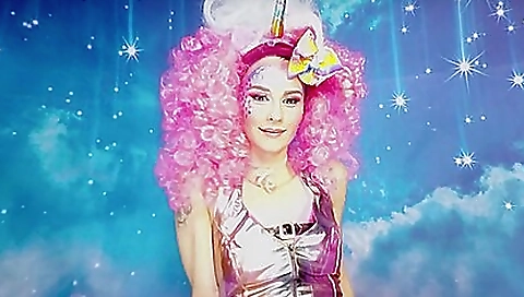 Horny teen masturbating using a vibrator in a bedroom